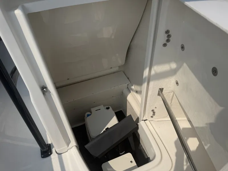 Slide: The Image of Interior view of a Robalo R200 Center Console boat with storage and seating area. - 4