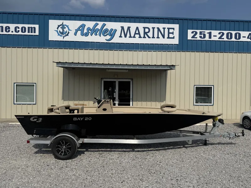 The Image of A 2027 G3 Bay 20 boat on a trailer in front of a building labeled "Ashley Marine." - 1