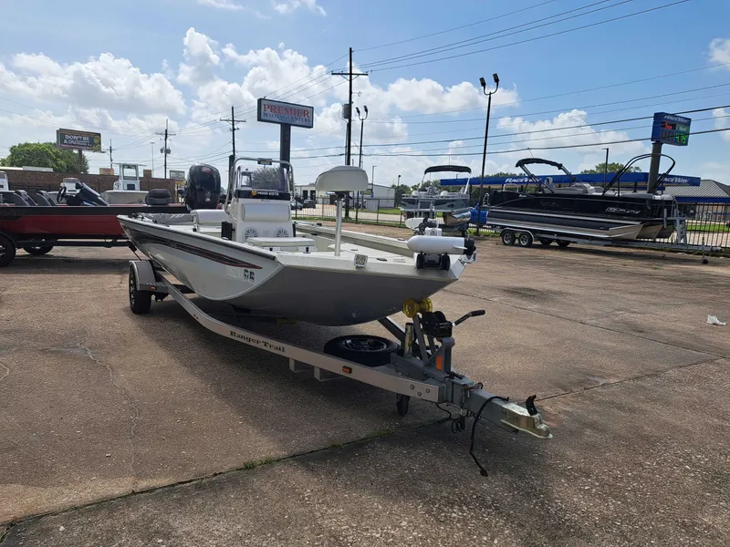 Slide: The Image of A 2022 Ranger RB190 boat is on a trailer in a parking lot. - 6