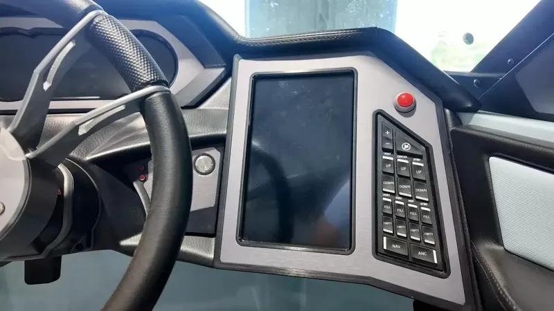 Slide: The Image of The image shows the dashboard of a 2024 MasterCraft XStarS with a large screen and controls. - 48