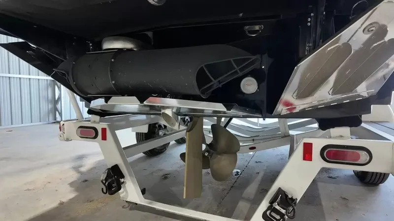 Slide: The Image of The image shows the underside of a 2024 MasterCraft XStarS with propeller and trailer. - 11