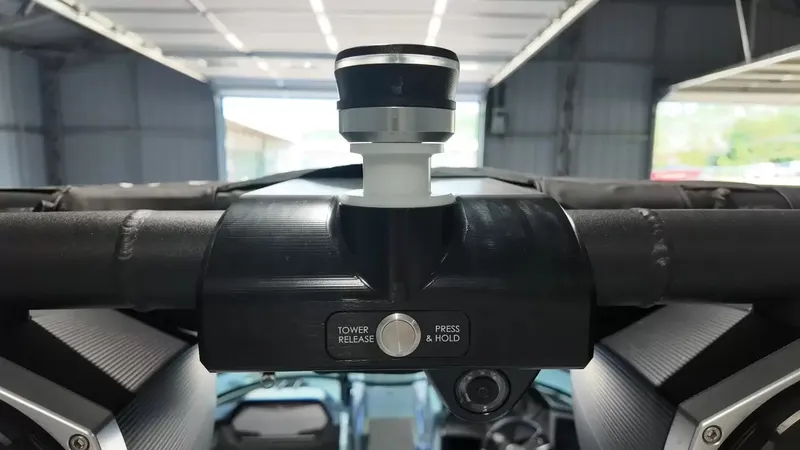 Slide: The Image of Close-up of a boat tower with a control knob and release mechanism. - 36