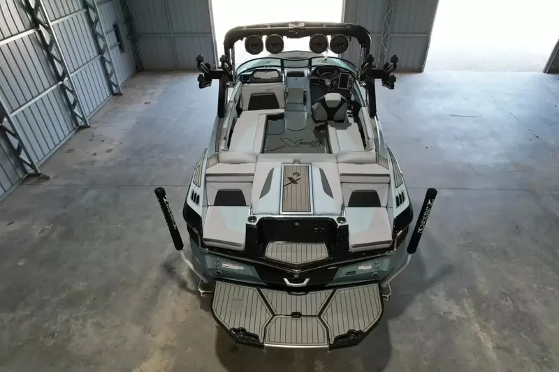 Slide: The Image of 2024 MasterCraft XStarS in a warehouse, featuring a sleek design and modern features. - 8