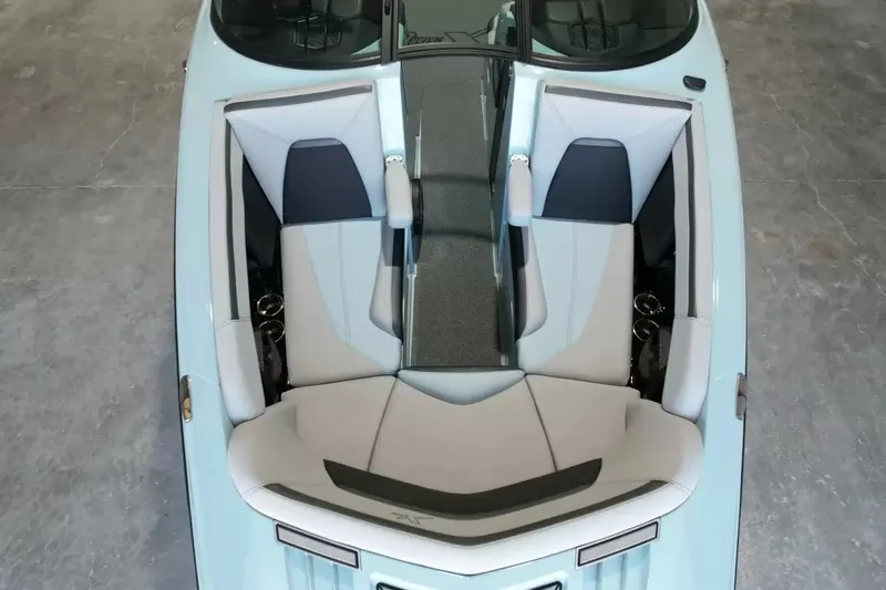 Slide: The Image of The 2024 MasterCraft XStarS features a sleek, modern cockpit with gray and white upholstery. - 24