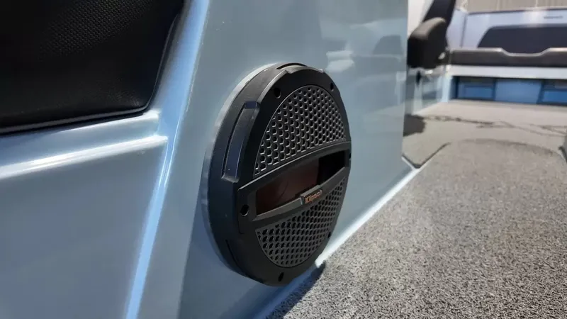 Slide: The Image of Close-up of a speaker in a modern boat, surrounded by gray carpeting. - 42