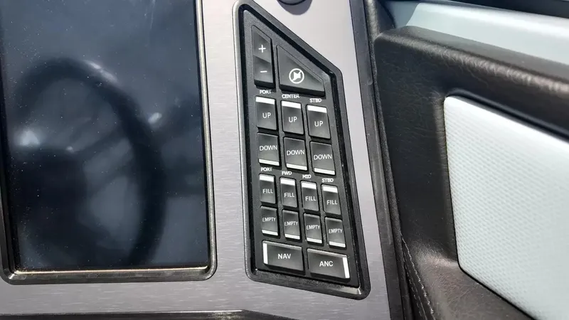 Slide: The Image of Close-up of a control panel with buttons for navigation and anchor control. - 49