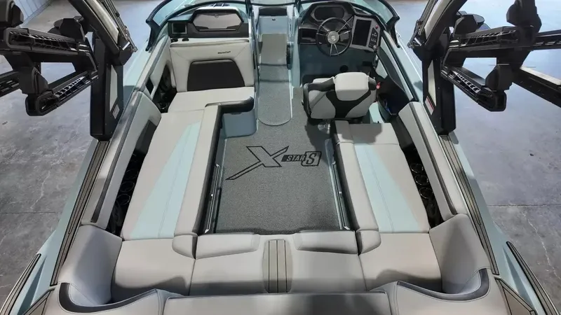 Slide: The Image of Interior view of a 2024 MasterCraft XStarS with gray upholstery and a modern dashboard. - 41