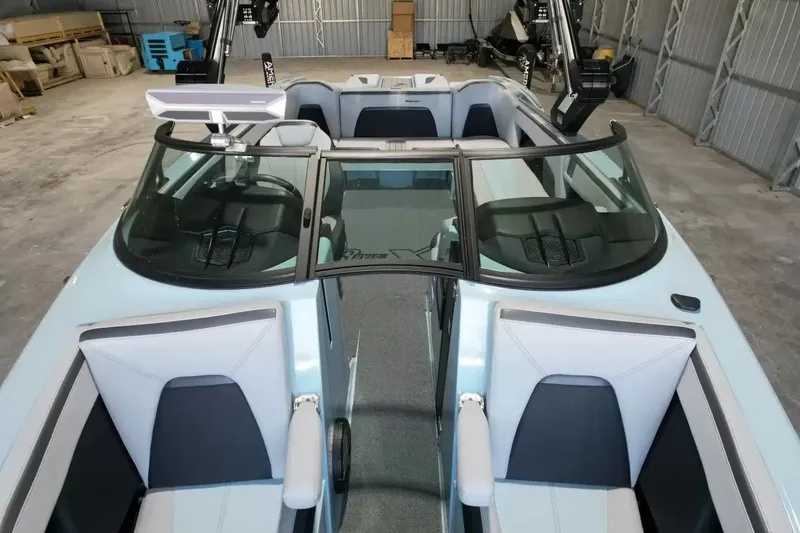 Slide: The Image of The image shows the interior of a 2024 MasterCraft XStarS boat with modern seating and fixtures. - 32