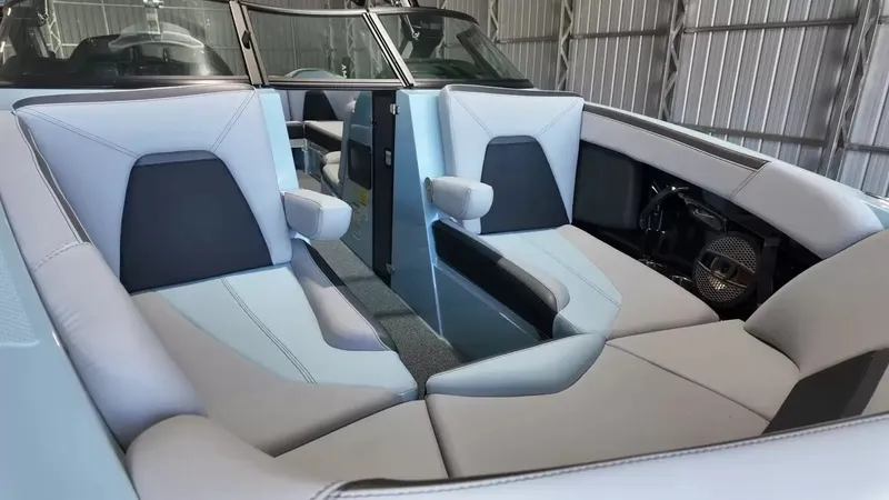 Slide: The Image of The image shows the luxurious interior of a 2024 MasterCraft XStarS with gray and black seating. - 30