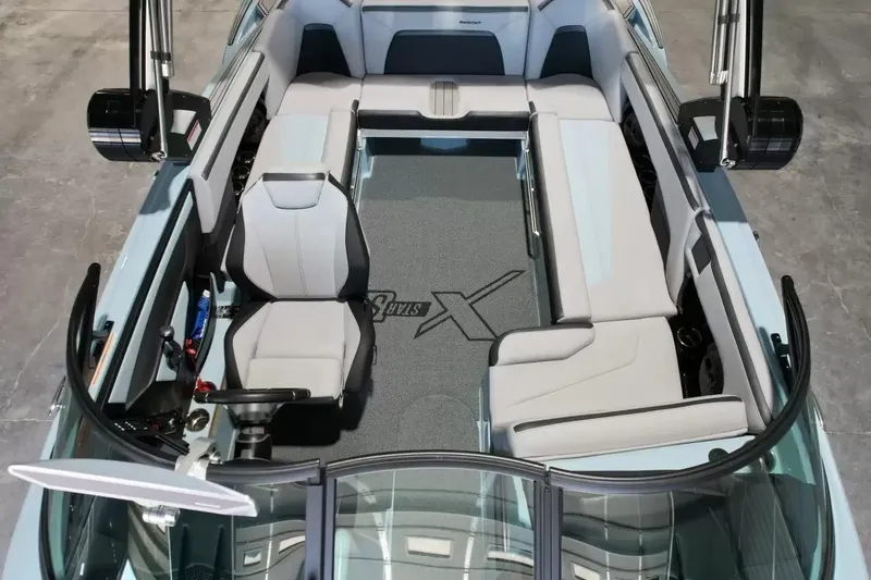 Slide: The Image of The image shows the interior of a 2024 MasterCraft XStarS boat with modern seating and sleek design. - 33