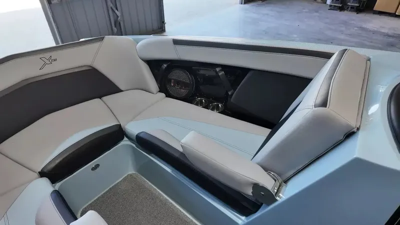 Slide: The Image of The image shows the interior of a 2024 MasterCraft XStarS with sleek, light gray upholstery. - 31