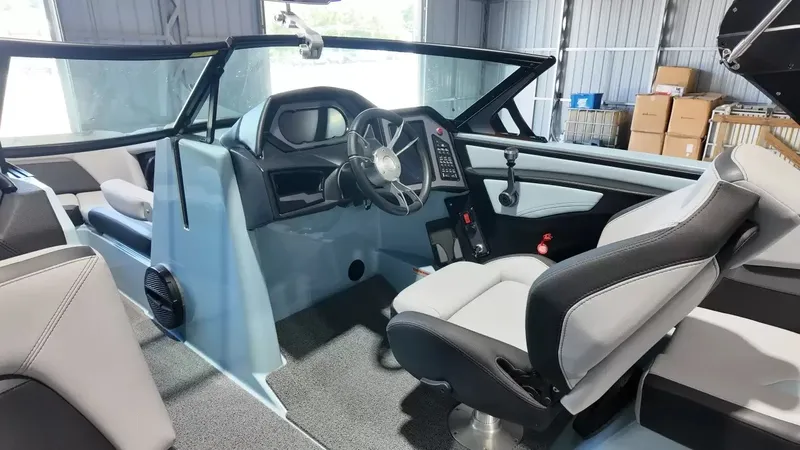 Slide: The Image of The image shows the cockpit of a 2024 MasterCraft XStarS with modern controls and comfortable seating. - 44