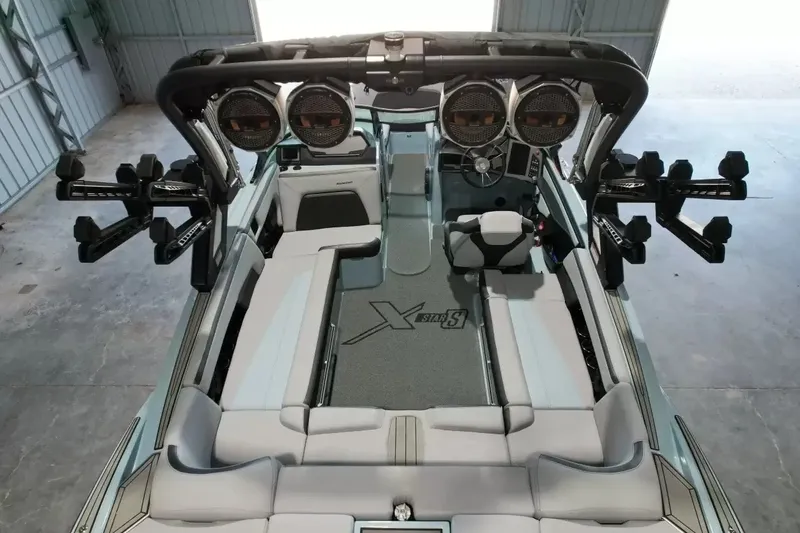 Slide: The Image of The image shows the interior of a 2024 MasterCraft XStarS boat with modern seating and speakers. - 35