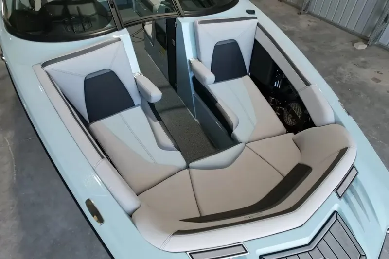 Slide: The Image of The image shows the interior of a 2024 MasterCraft XStarS with sleek, modern seating and gray accents. - 22