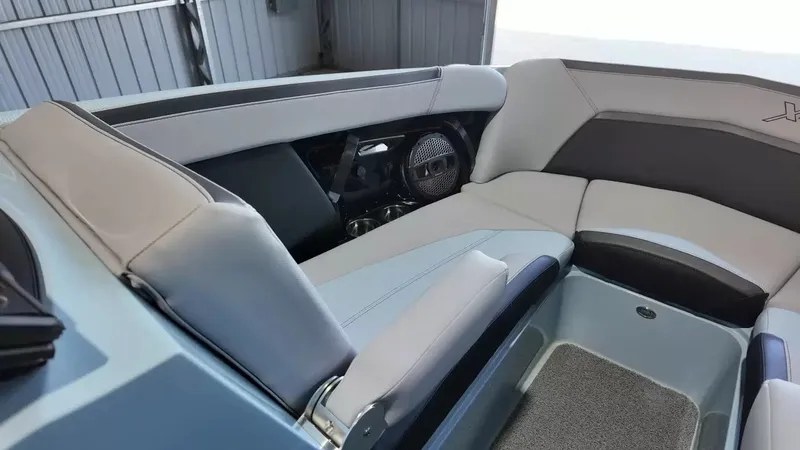 Slide: The Image of The image shows the interior of a 2024 MasterCraft XStarS with sleek seating and speakers. - 27
