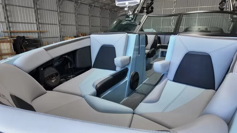 Slide: The Image of The image shows the interior of a 2024 MasterCraft XStarS boat with modern, cushioned seating. - 25