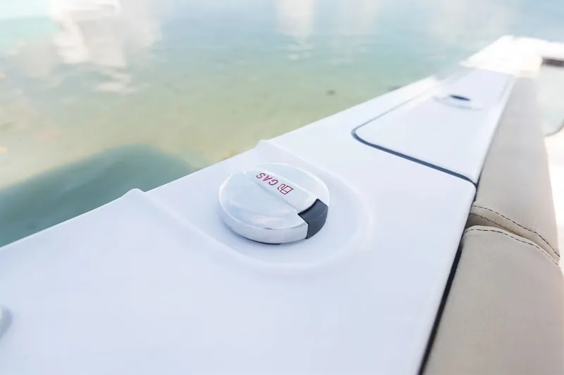 Slide: The Image of Close-up of a white boat deck with a "No Gas" cap. - 15