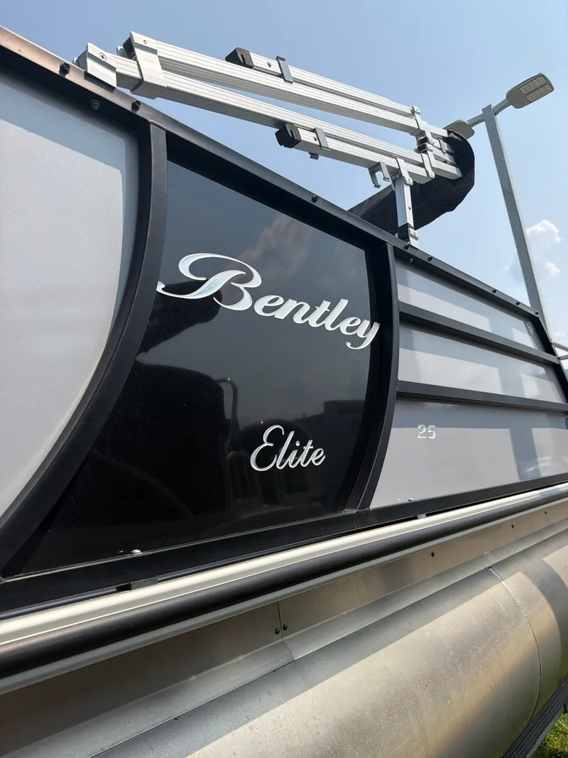 Slide: The Image of Close-up of a 2022 Bentley Elite 253 Tritoon, featuring sleek design and glossy finish. - 5