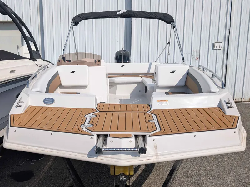 Slide: The Image of The image shows a 2025 Starcraft SVX 171 OB boat with wood decking and seating. - 4