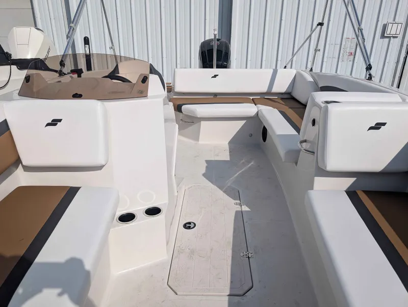 Slide: The Image of The image shows the cockpit of a 2025 Starcraft SVX 171 OB with white and brown seating. - 11