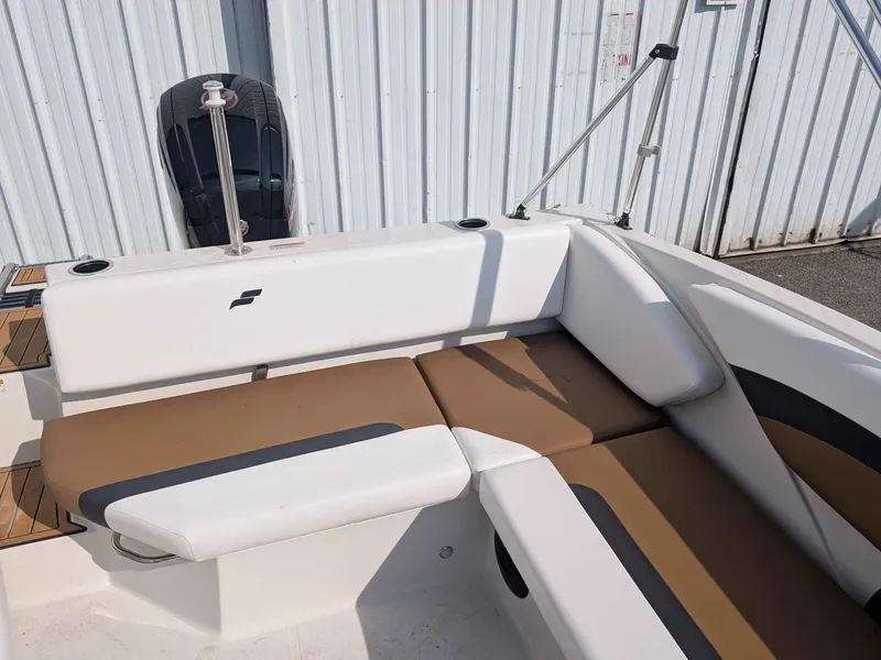 Slide: The Image of The image shows the cockpit of a 2025 Starcraft SVX 171 OB with white and brown seating. - 15
