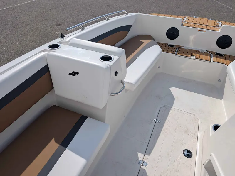 Slide: The Image of The image shows the cockpit of a 2025 Starcraft SVX 171 OB with cushioned seats and cup holders. - 9