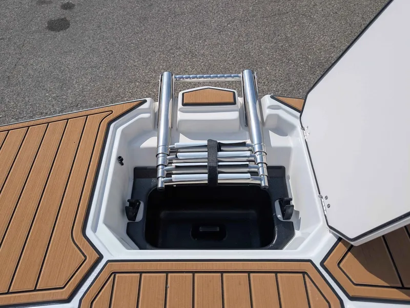 Slide: The Image of The image shows a built-in swim ladder on a boat with a wood-patterned deck. - 6