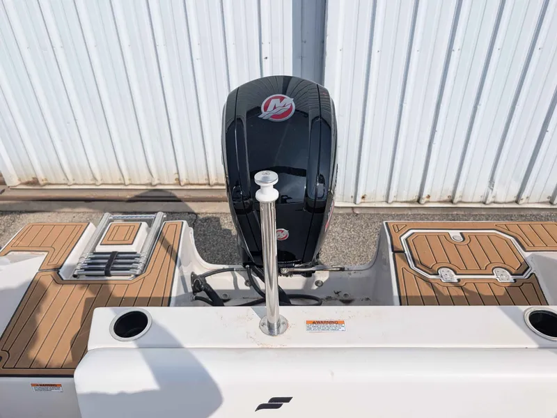 Slide: The Image of The image shows the stern of a Starcraft SVX 171 OB boat with an outboard motor. - 16