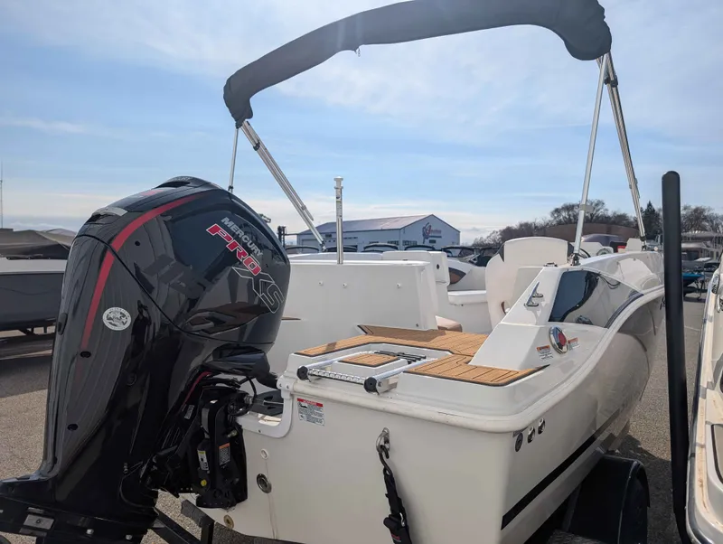 Slide: The Image of The image shows a 2025 Starcraft SVX 171 OB boat with an outboard motor. - 18