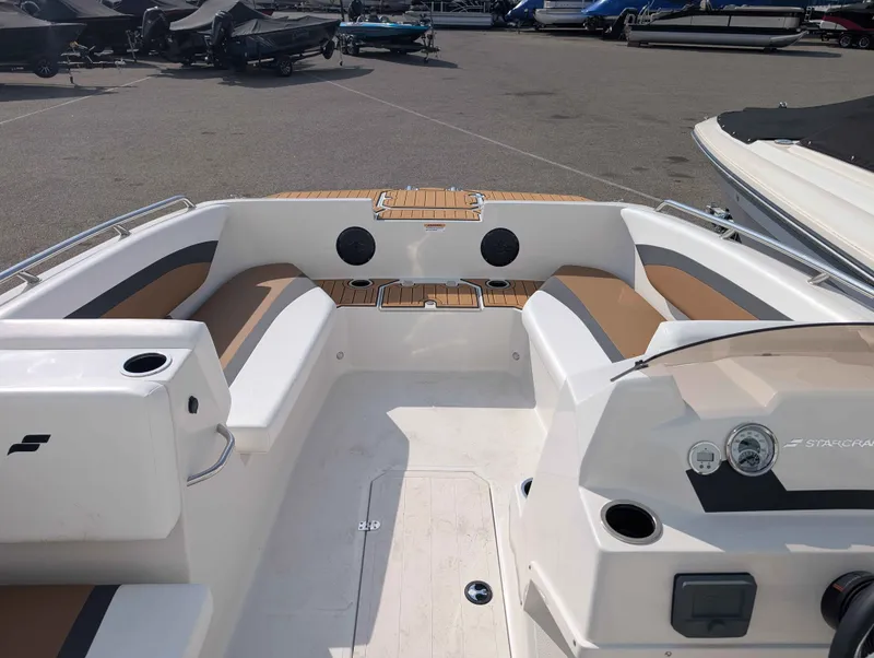 Slide: The Image of The image shows the cockpit of a 2025 Starcraft SVX 171 OB with beige seating. - 8