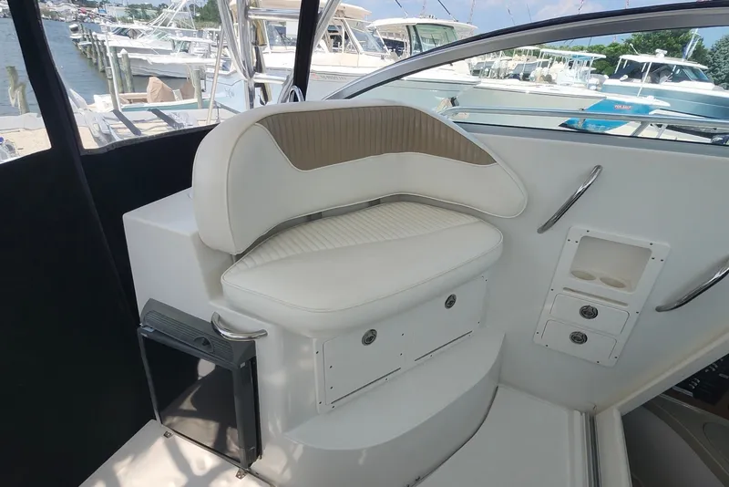 Slide: The Image of 2005 Seaswirl Striper 2901 Walkaround O/B interior with cushioned seating and storage compartments. - 14