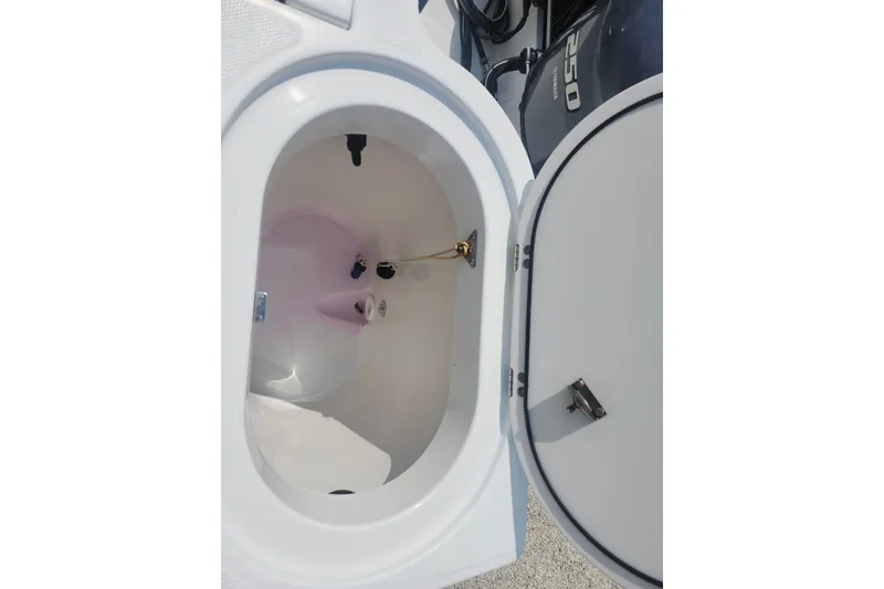 Slide: The Image of Open storage compartment on a 2005 Seaswirl Striper 2901 Walkaround O/B boat. - 31