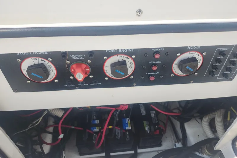Slide: The Image of Control panel of a 2005 Seaswirl Striper 2901 Walkaround O/B boat, featuring engine switches. - 34
