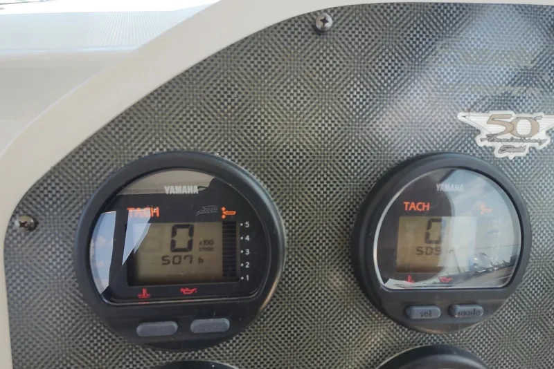 Slide: The Image of Dashboard of a 2005 Seaswirl Striper 2901 Walkaround O/B with Yamaha tachometers. - 17