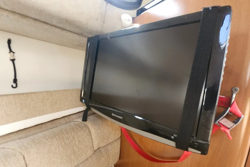 Slide: The Image of Flat-screen TV secured in a 2005 Seaswirl Striper 2901 Walkaround O/B cabin. - 29
