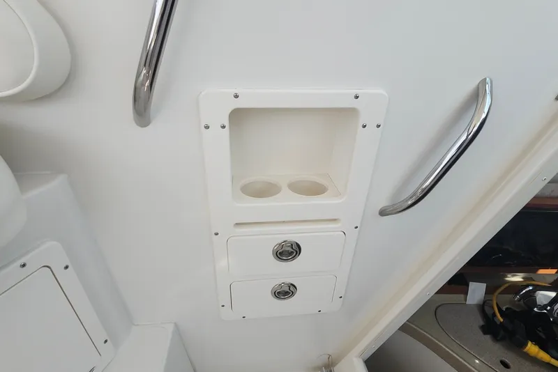 Slide: The Image of Interior of 2005 Seaswirl Striper 2901 Walkaround O/B with storage compartments and handrails. - 23