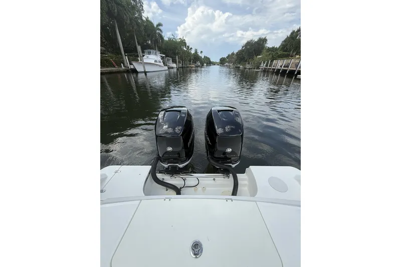Slide: The Image of 2016 Boston Whaler 330 Outrage boat with dual engines on a scenic waterway. - 31