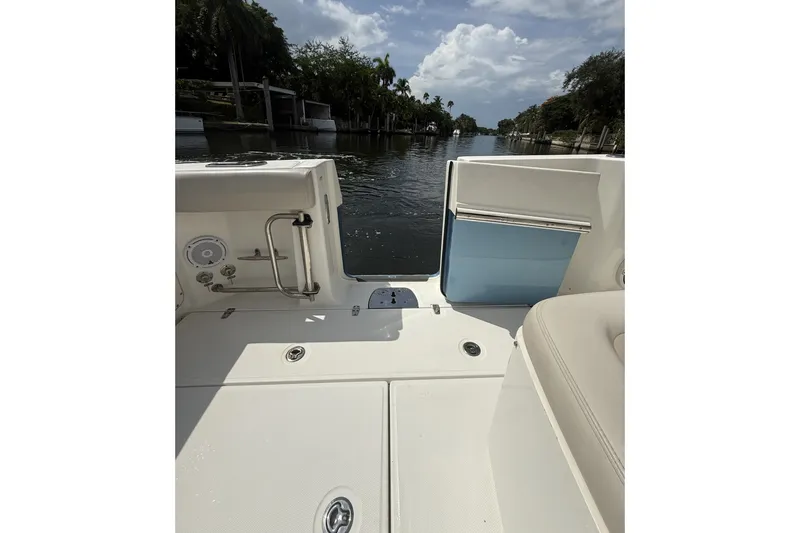 Slide: The Image of Boston Whaler 330 Outrage 2016 boat interior with waterway view and clear skies. - 19