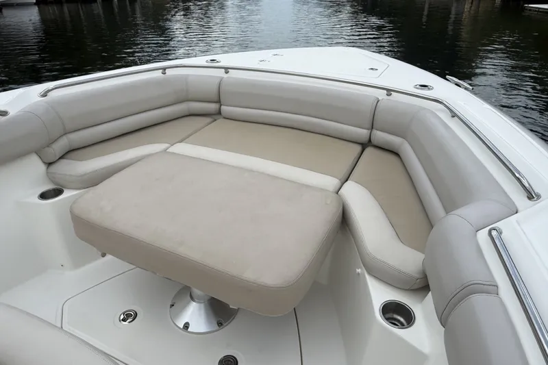 Slide: The Image of Luxurious seating area on a 2016 Boston Whaler 330 Outrage boat. - 13