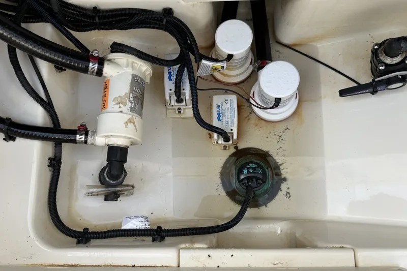 Slide: The Image of Bilge area of a 2016 Boston Whaler 330 Outrage with pumps and wiring. - 37