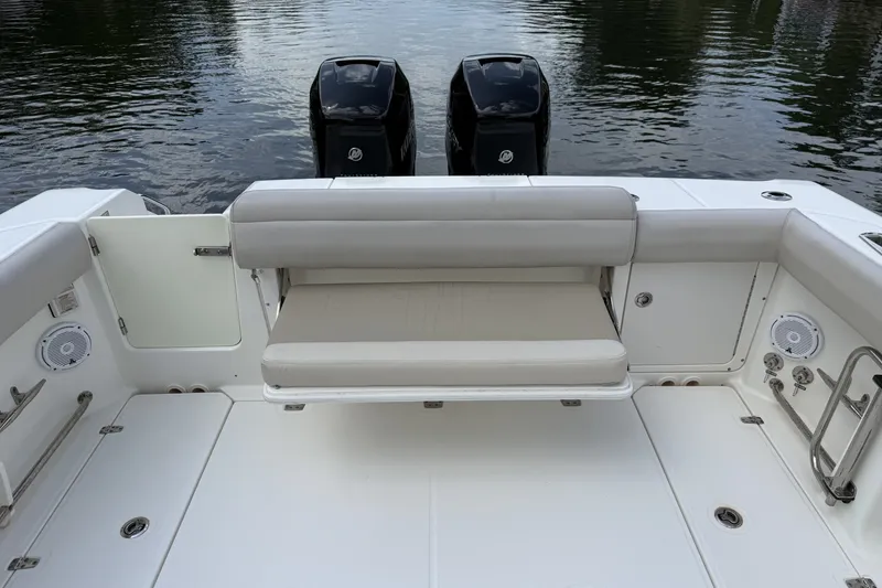 Slide: The Image of 2016 Boston Whaler 330 Outrage boat with dual engines and rear seating. - 22