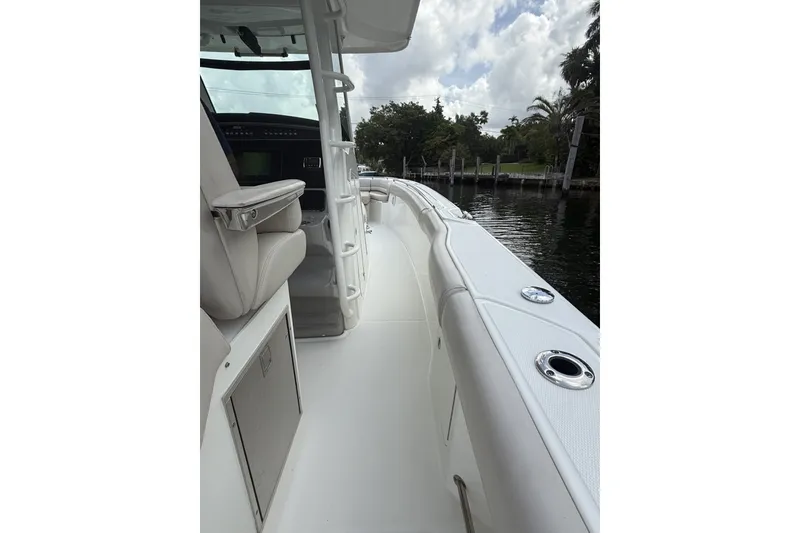 Slide: The Image of 2016 Boston Whaler 330 Outrage boat interior with seating and water view. - 28