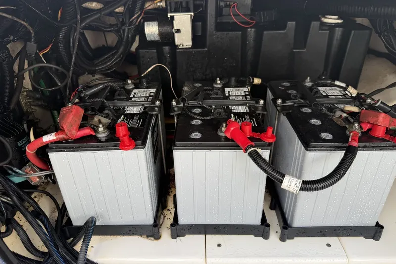 Slide: The Image of Batteries in a 2016 Boston Whaler 330 Outrage boat engine compartment. - 34