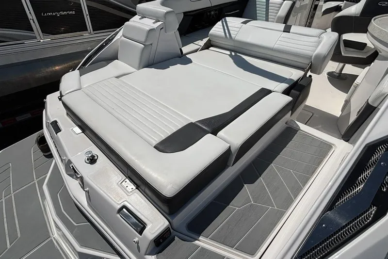 Slide: The Image of 2016 Regal 24 FasDeck boat with spacious, cushioned seating area. - 13