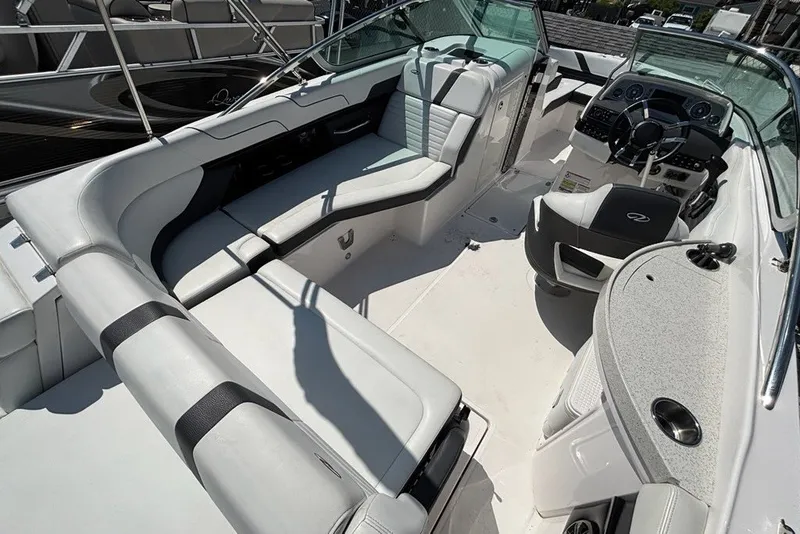 Slide: The Image of 2016 Regal 24 FasDeck boat interior with spacious seating and modern dashboard. - 11