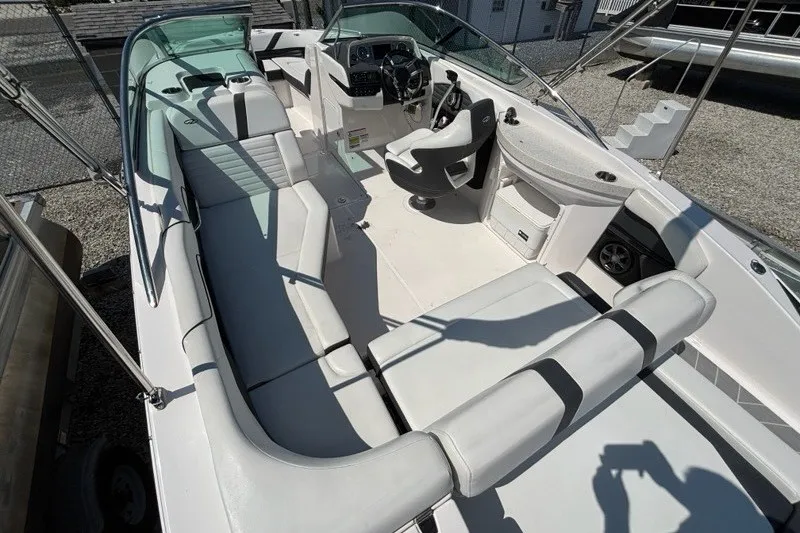 Slide: The Image of 2016 Regal 24 FasDeck boat interior with spacious seating and modern helm. - 12