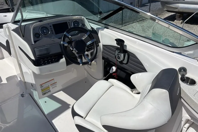 Slide: The Image of Cockpit of 2016 Regal 24 FasDeck boat with steering wheel and control panel. - 6