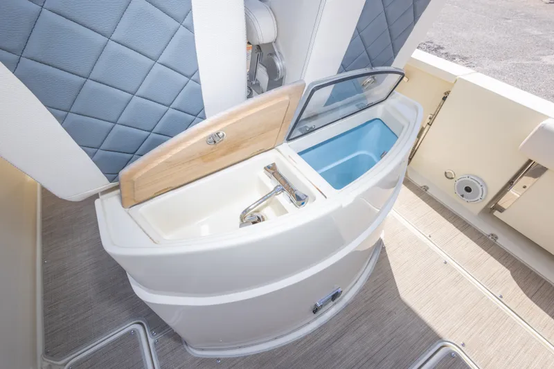Slide: The Image of 2023 Chris-Craft Catalina 30 boat interior with sink and storage compartment. - 51
