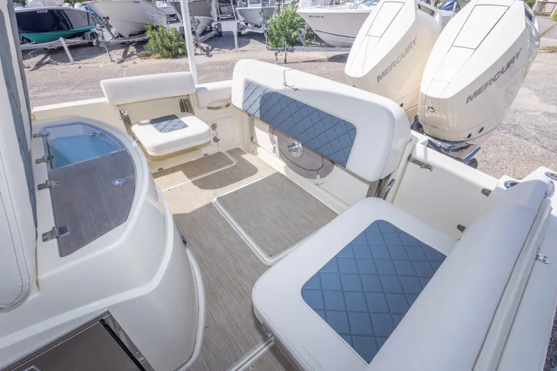 Slide: The Image of 2023 Chris-Craft Catalina 30 boat interior with seating and Mercury engines. - 53