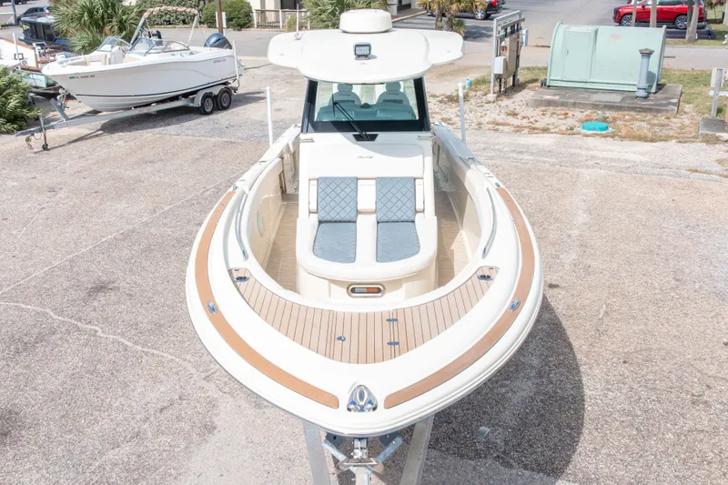 Slide: The Image of 2023 Chris-Craft Catalina 30 boat with elegant deck design and comfortable seating. - 5